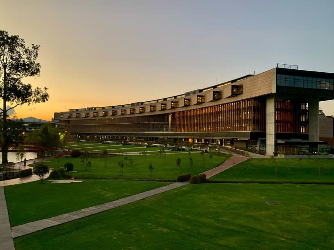 college campus building with green lawn