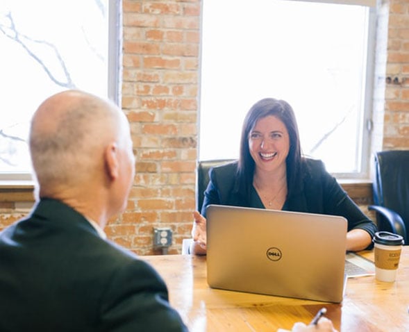 happy woman at computer with man