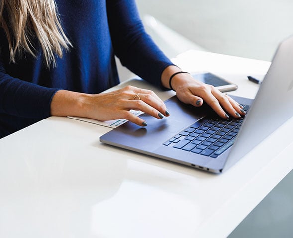 woman scheduling rooms and events on computer