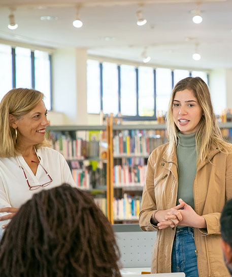 library two women standing